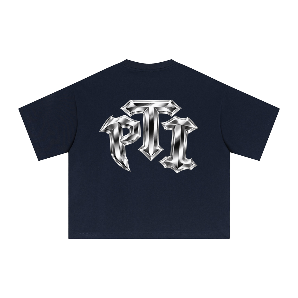 A navy blue short-sleeve t-shirt shown from the back, featuring a large metallic silver gothic-style 'PTI' logo printed across the center.