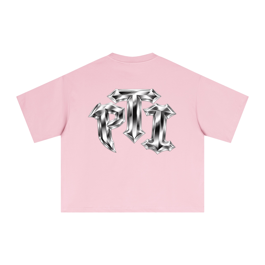 A light pink short-sleeve crop top shown from the back, featuring a large metallic silver gothic-style 'PTI' logo printed across the center.