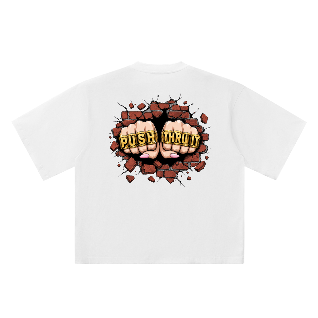 A white short-sleeve t-shirt shown from the back, featuring a graphic print of two fists breaking through a wall of bricks with the text 'PUSH THRU IT' in yellow.